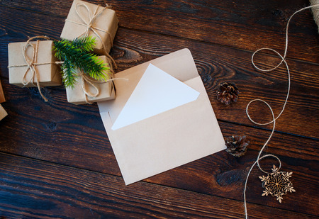 Mokcup Christmas composition of gift boxes and letter on a background and place for text
