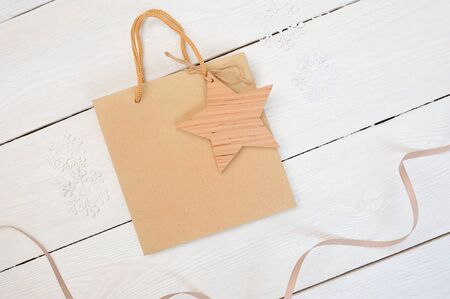 mockup Christmas composition kraft package on wooden white background. Flat lay, top viewの写真素材