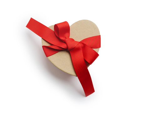 Wrapped vintage heart gift box with red ribbon bow, isolated clipping mask on white background, top view, illustration for valentines day or weddingの写真素材