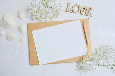 Mockup envelope with flowers and hearts for letter, place for textの写真素材