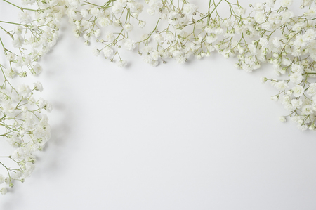 Mock up Composition of white flowers rustic style with a place for your text. Flat lay, top view photo mock up.の写真素材