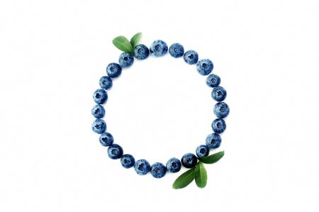 Summer blueberry round frame isolated on white background. Berries border design. Close up top view or flat lay with place for your textの写真素材