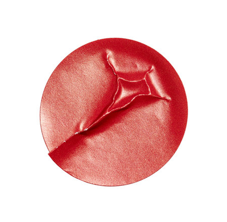 Blank red round crumpled paper promotion sticker label cutout isolated on a white backgroundの写真素材