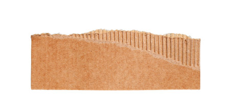 Ripped corrugated cardboard piece with torn top edge, creating textured brown recycled paper element, transparent backgroundの写真素材