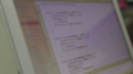 Blurry view of professional development programmer working in programming website a software and...