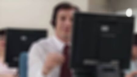 Young attractive businessman happy and successful at work at computer desk satisfied and smiling...