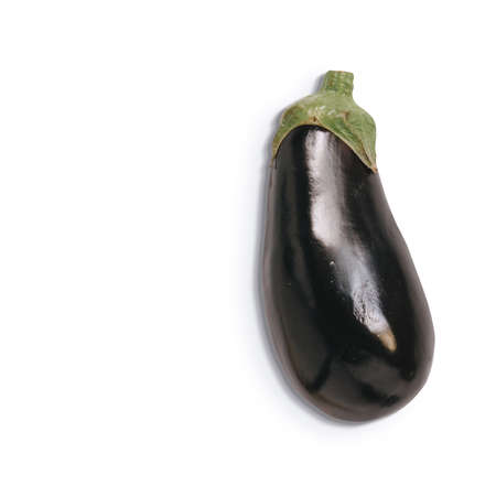 Top view of isolated eggplant on white background. Fresh aubergine with shadow and copyspace for textの写真素材