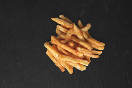 Close up view delicious fried potatoes. isolated on black background. suitable for your food design...