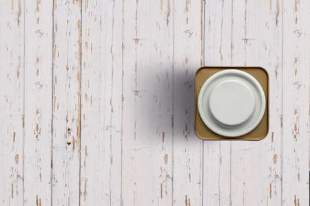Top up up view white tea tins isolated on white wooden background. suitable for your design project.の写真素材