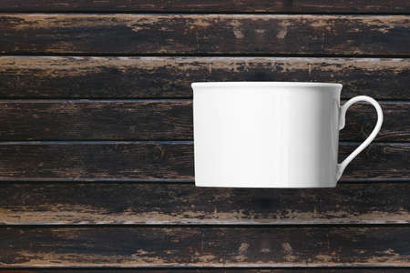 White cup over wooden background.の写真素材