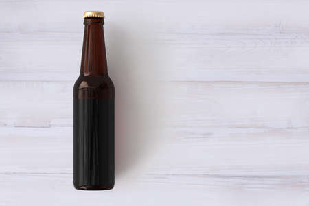 Beer Bottle Mock-Up with Blank Label on wooden background . oktoberfest concept.の写真素材