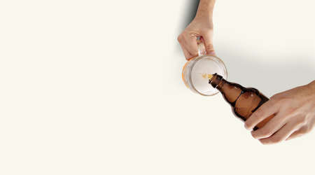 Two Man Hands With Beer Mug and bottle On White Backgroundの写真素材