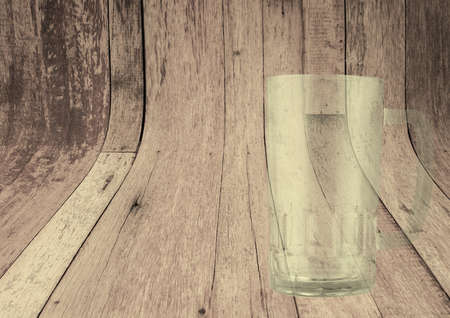 Empty transparent beer glass isolated on wooden backgroundの写真素材