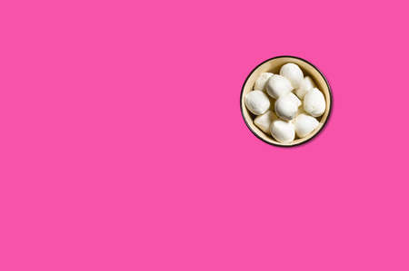 Cheese piece in Creative conceptual top view flat lay composition with copy space isolated on pink background in minimal styleの写真素材