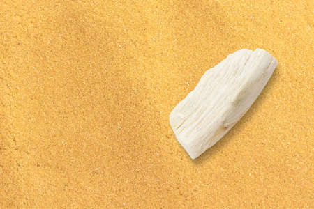 Wooden Direction indicator on sand. Small piece of wood for logo. added Copy space.