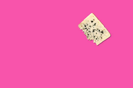 Cheese piece in Creative conceptual top view flat lay composition with copy space isolated on pink background in minimal styleの写真素材