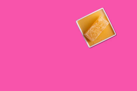 Cheese piece in Creative conceptual top view flat lay composition with copy space isolated on pink...