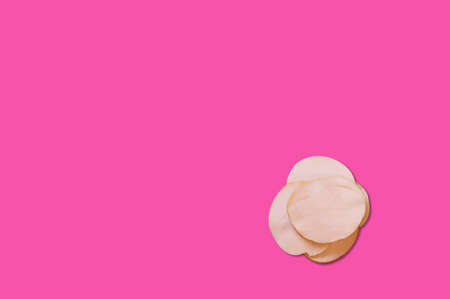 Cheese piece in Creative conceptual top view flat lay composition with copy space isolated on pink background in minimal styleの写真素材