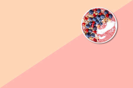 Close up view of wheat porridge with blueberry isolated on pink background.の写真素材