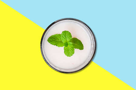 Vanilla juice on small cup with mint leaf flat lay concept isolated.の写真素材