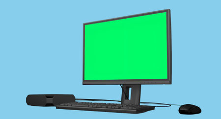 A computer monitor with a green screen, keyboard, and speaker, ideal for presentations or graphic design.の写真素材