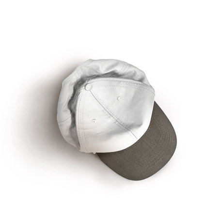 White and black snapback cap mockup on a grey background.の写真素材