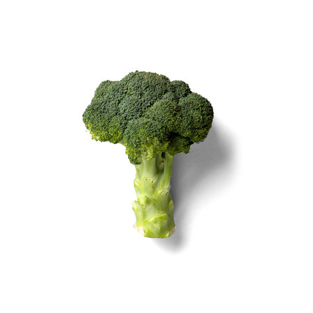 Close up view organic broccoli against white background.