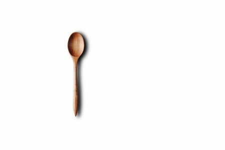 Directly Above View Of Wooden Spoon Against White Backgroundの写真素材