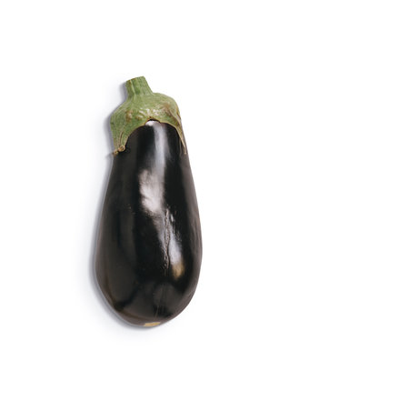 Top view of isolated eggplant on white background. Fresh aubergine with shadow and copyspace for textの写真素材