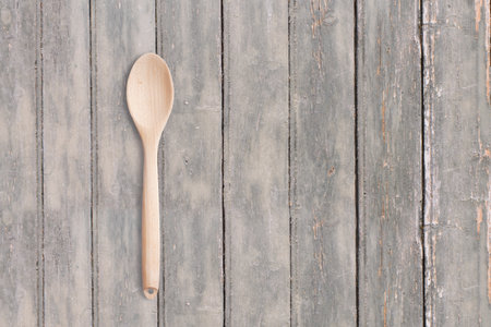 Top up view wooden spoon on dark wooden vintage table . added copy space for text , suitable for your food or drink concept background.の写真素材
