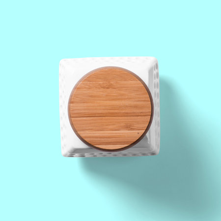 Top up view white coffee cup isolated on bright blue background.の写真素材