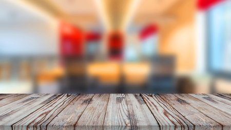 An empty wooden table on office for display items.