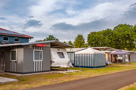 VERSMOLD, GERMANY. JUNE 20, 2021 Campingpark Sonnensee. Tents, lodges people resting in the forestのeditorial素材