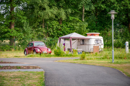 VERSMOLD, GERMANY. JUNE 20, 2021 Campingpark Sonnensee. Tents, lodges people resting in the forestのeditorial素材