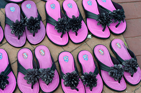 Colorful pink ladies shoes for sale on the street.の写真素材