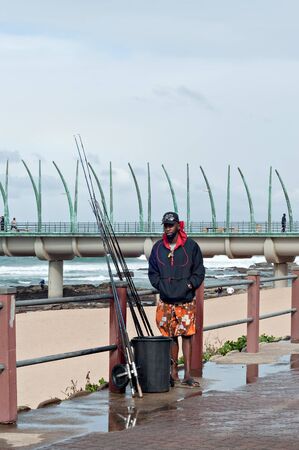 DURBAN, SOUTH AFRICA - JULY 09, 2016: Fisherman at the beach near the Millennium Pier in Umhlanga Rocksのeditorial素材