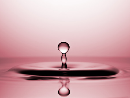 Water Drop Macro, Rose colored backroundの写真素材