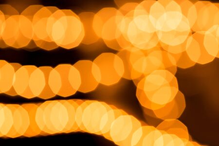 Abstract golden background, circular bokeh, out of focus lightsの写真素材