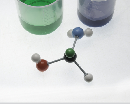Molecule with various aspects of its compents and liquids in beakers.の写真素材