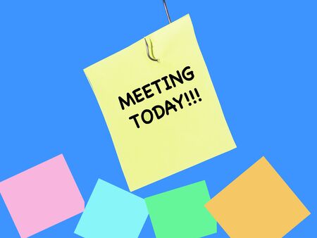 Sticky notes   with aa reminder for meeting today being fished out for urgency .の写真素材