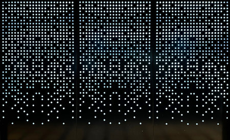 Beautiful laser cut screens in random square pixelated mode with LED backlights shining from behind.の写真素材