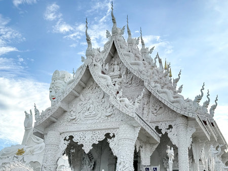 Wat Huay Pla Kang, or Temple of Goddess of Mercy, at Chiang Rai, Thailand. Big Guan Yin Buddha statue with its holy white temple, sitting on the hill mountain top or summit.の写真素材