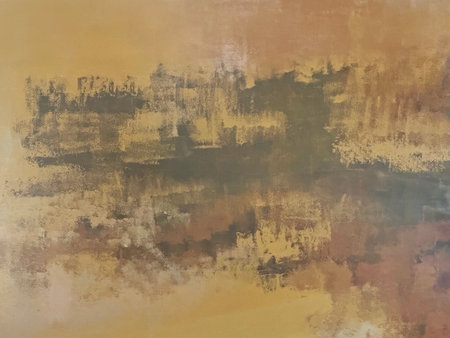 Gold textured paint with rusty oxidized metals washed on a wall or panel, seamless texture, random texture. Golden washed metallic paint on wall.の写真素材