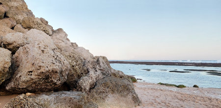Rocks formations, cliffs, and sea coastlines at the southernmost point of tropical paradise, Bali, Indonesia. Located at Melasti Beach, Uluwatu, Bali, kissed by the tropical breezeの写真素材