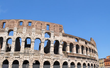 The Colosseum amphitheater  at Rome, early morning with a sunny sky.の写真素材