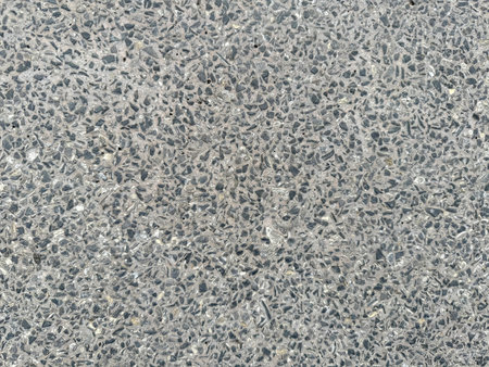Natural small grey coral stone cemented into slabstone with terrazzo texture. Cobblestones or terrazzo natural grey seamless texture.の写真素材