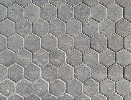 Hexagon outdoor paving stone tiles, paving cobble stone in grey natural stone color.