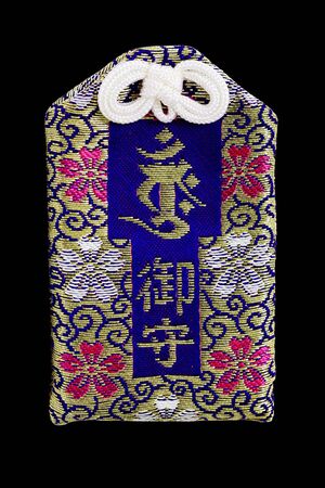 Japanese amulet in gold and purpleの写真素材