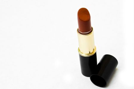 Maroon lipstick with lid off isolated against white backgroundの写真素材