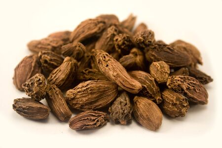 Black cardamom isolated on white